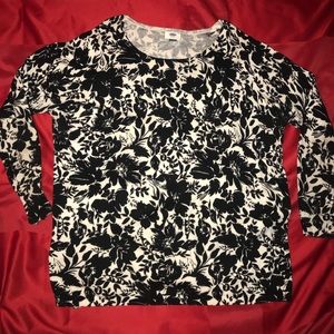White long sleeved sweater with black flowers